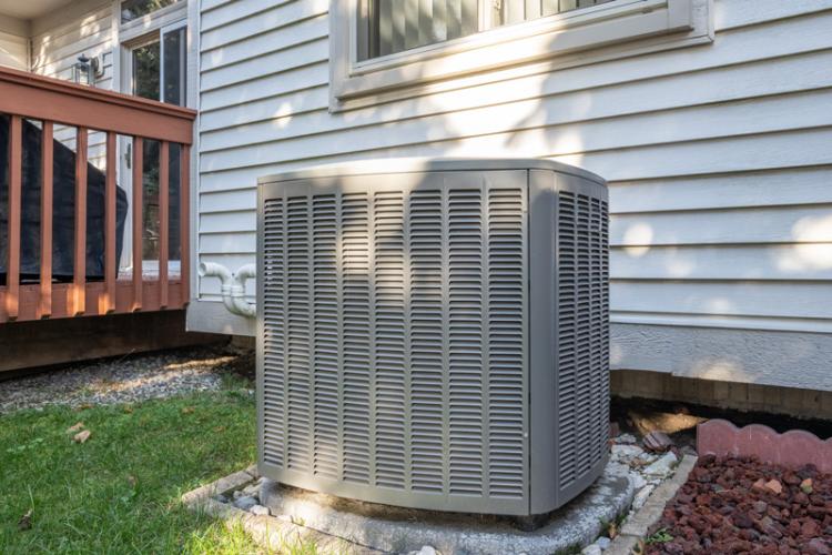 an outdoor ac unit at a house.